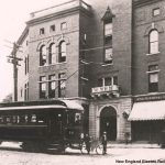 black and white trolley in front of a building